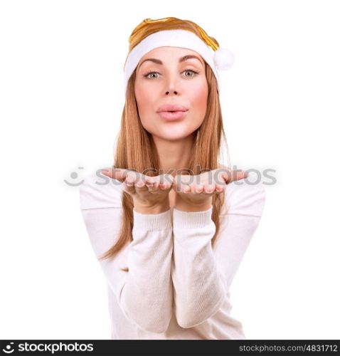 Beautiful Santa helper, portrait of attractive woman wearing festive golden hat sends an air kiss isolated on white background, happy Christmas holidays