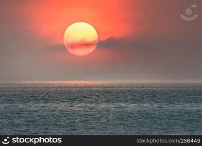 Beautiful scence of big sun on sky over the sea. big sun and sea