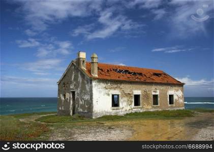 Beautiful scene of an old abandoned house close to the coast