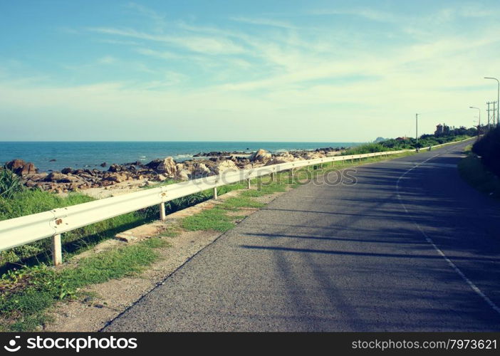 Beautiful scene of Viet Nam coastal, boundary among beach and road, wonderful landscape at Vietnamese countryside, shadow on street, this view at Lagi, Binh Thuan, VietNam