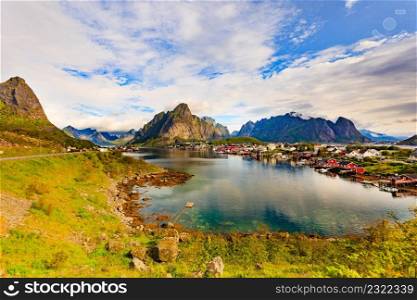 Beautiful scenery fjord landscape with Reine village, coast nature with sharp high mountain peaks, Lofoten islands North Norway. Travel destination.. Fjord and mountains landscape. Lofoten Norway