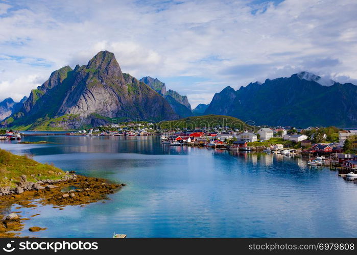 Beautiful scenery fjord landscape with Reine village, coast nature with sharp high mountain peaks, Lofoten islands North Norway. Travel destination.. Fjord and mountains landscape. Lofoten Norway