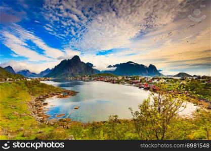 Beautiful scenery fjord landscape with Reine village, coast nature with sharp high mountain peaks, Lofoten islands North Norway. Travel destination.. Fjord and mountains landscape. Lofoten Norway