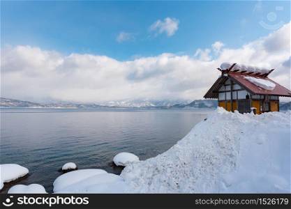 Beautiful scenery of lake tazawa or tazawako cover by snow in winter Akita Japan.