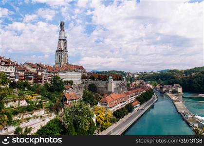 Beautiful scenery of Matteschwelle in Aare river and Evangelical Church tower view in Bern old town area, Switzerland