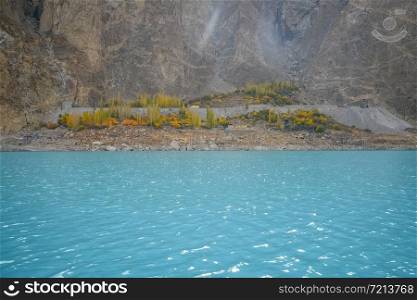 Beautiful scenery of turquoise blue water of Attabad lake in autumn season. Gojal, Hunza Valley. Gilgit Baltistan, Pakistan.