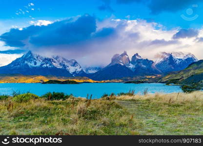 Beautiful scenic landscape of National Park Torres del Paine with Pehoe Lake and foggy mountain in the evening, Chile