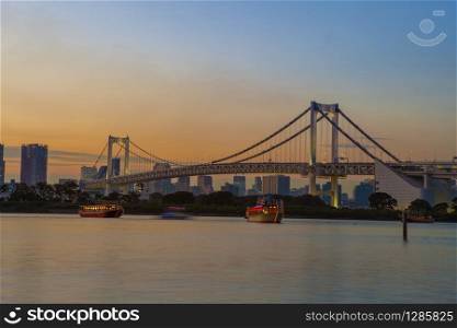 beautiful scenic twilight time of rainbow bridge odaiba harbor tokyo japan