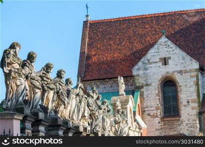 beautiful sculpture of 12 apostles against the background of the. beautiful sculpture of 12 apostles against the background of the Catholic Church in Krakow