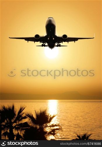 beautiful sea view and plane on sunset background