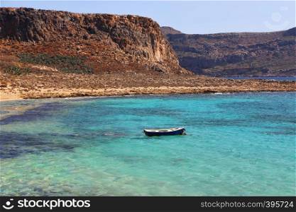 Beautiful sea view with clear turquoise water and empty boat, Gramvousa, Crete island, Greece