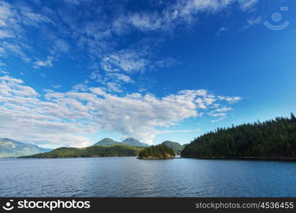 Beautiful seascape along Pacific coast of British Columbia, Canada, with rocky shoreline.