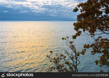 Beautiful seascape, autumn sea, clouds over the water surface, autumn on the seashore.