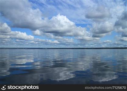 Beautiful seascape, clouds reflected in the sea , View from a boat