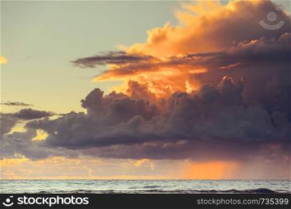 Beautiful seascape evening Baltic sea sunset horizon and cloudy sky. Tranquil scene. Natural background. Landscape.. Beatiful sunset with clouds over the Baltic sea