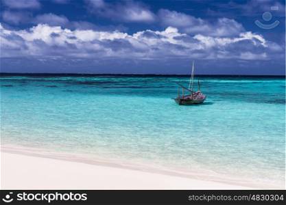 Beautiful seascape, little fishing boat in the ocean, luxury beach resort, paradise beach, small water transport to Maldives island