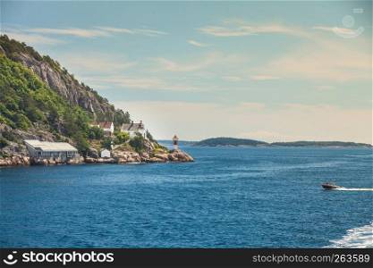Beautiful seascape norwegian coastline, coast of Kristiansand with small lighthouse, Scandinavia Europe.. Norwegian coastline with lighthouse