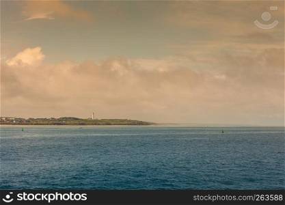 Beautiful seascape sea horizon and coastline with lighthouse Hirtshals, Denmark, Europe.. Coastline with lighthouse Hirtshals Denmark