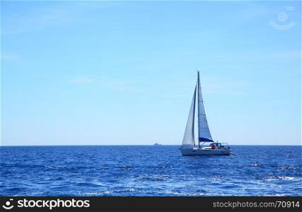 Beautiful seascape with sea horizon and sail boat