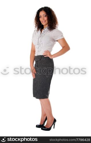 Beautiful self confident curly brunette corporate business woman standing with hand on hip and smiling wearing skirt blouse and black pumps, isolated.