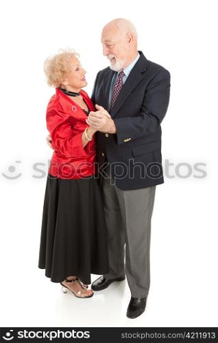 Beautiful senior couple dressed up and dancing together. Full body isolated on white.