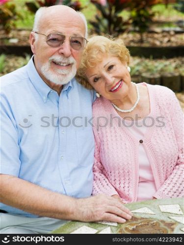 Beautiful senior couple in love in an outdoor setting.