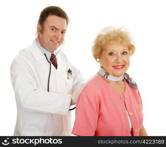 Beautiful senior lady getting her annual physical at the doctors office. Isolated on white.