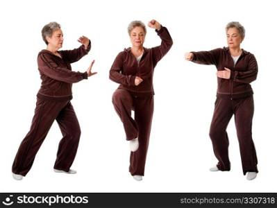 Beautiful Senior woman doing Tai Chi exercise to keep her joints flexible, isolated.