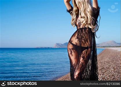 Beautiful sensual blonde at the sea. Summer travel photos