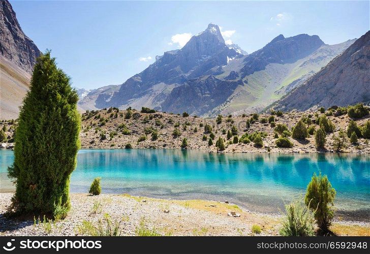 Beautiful serene lake in  Fanns mountains (branch of Pamir) in Tajikistan.