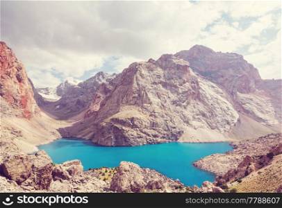 Beautiful serene lake in Fanns mountains (branch of Pamir) in Tajikistan.