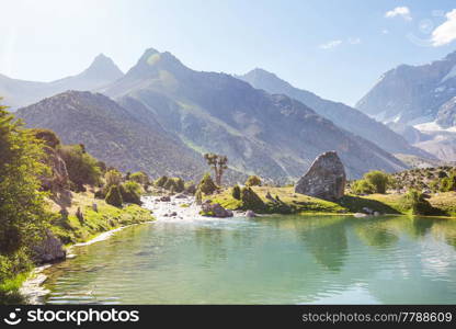 Beautiful serene lake in Fanns mountains (branch of Pamir) in Tajikistan.