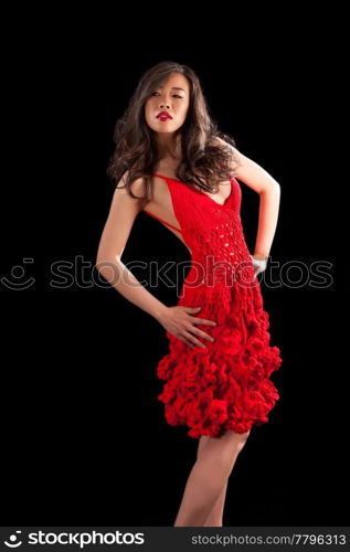 Beautiful sexy Asian woman in a crochet red dress, isolated