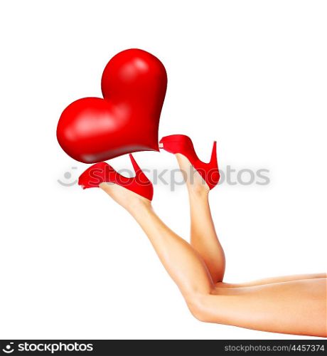 Beautiful sexy female legs holding up the big red heart, wearing stylish high heels isolated on white background with text space, Valentine&rsquo;s day romantic holiday, love concept