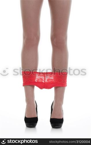 Beautiful Sexy Legs in black high heels and underwear over white background