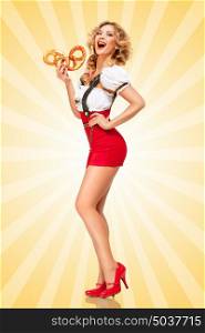 Beautiful sexy Oktoberfest woman wearing red jumper shorts with suspenders in a form of a traditional dirndl, holding two pretzels on colorful abstract cartoon style background.