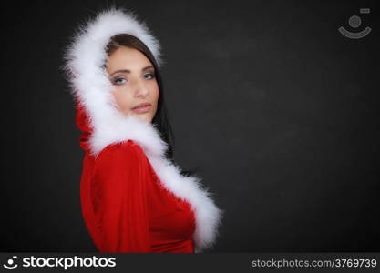 Beautiful sexy woman wearing santa clause costume clothes on black background