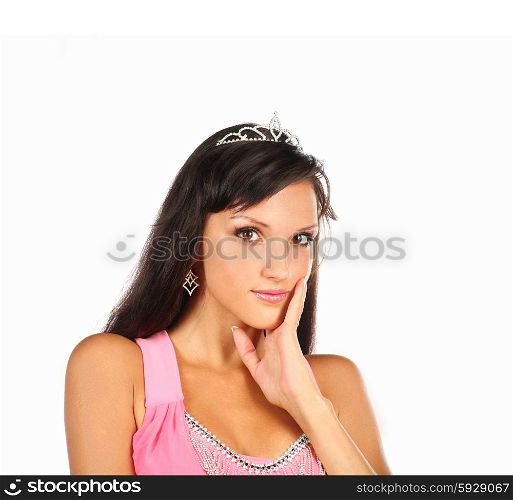 Beautiful sexy young brunette woman with princess crown. Portrait of a pretty fashion model posing at studio.