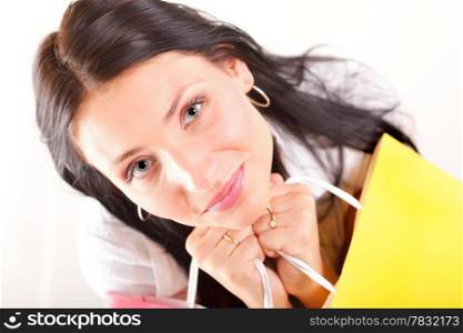 Beautiful shopping woman happy holding paper bags