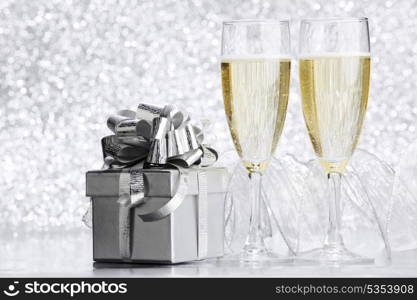 Beautiful silver christmas card with champagne and gift