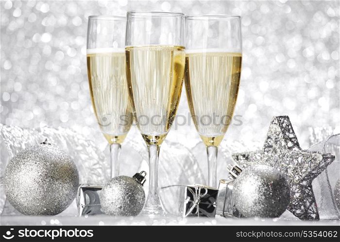 Beautiful silver christmas card with champagne and gift