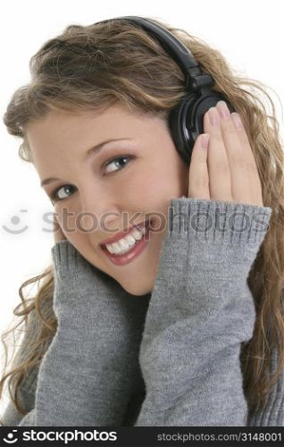 Beautiful sixteen year old teen girl listening to headphones.
