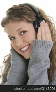 Beautiful sixteen year old teen girl listening to headphones.