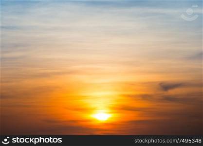 Beautiful sky and clouds with orange dramatic sunset. Can be used as abstract or nature background