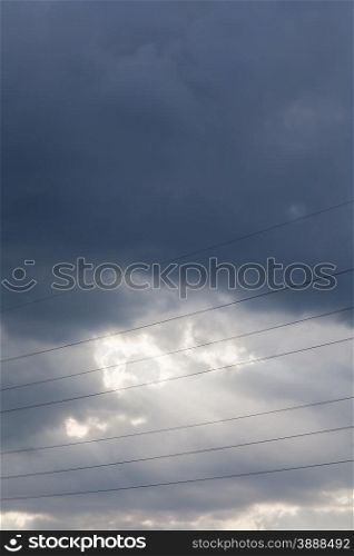 beautiful sky background with clouds and rays and wires
