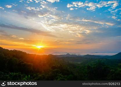 Beautiful sky sunrise asia landscape on hill with fog mist in the morning