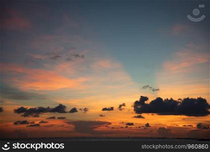 Beautiful sky sunset silhouette cloud colorful orange and blue dramatic sky background on the tropical sea summer