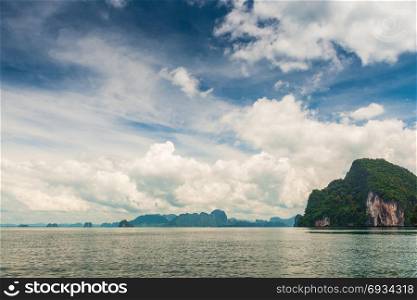 beautiful sky with cumulus clouds over the picturesque mountains in the Andaman Sea, Thailand