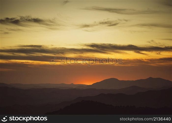 beautiful sky yellow shades with mountains