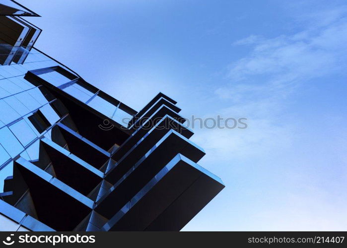 Beautiful skyscraper with architecture and glass window exterior of building around business area in the city. Closeup. Beautiful skyscraper with architecture and glass window exterior of building around business area in the city.